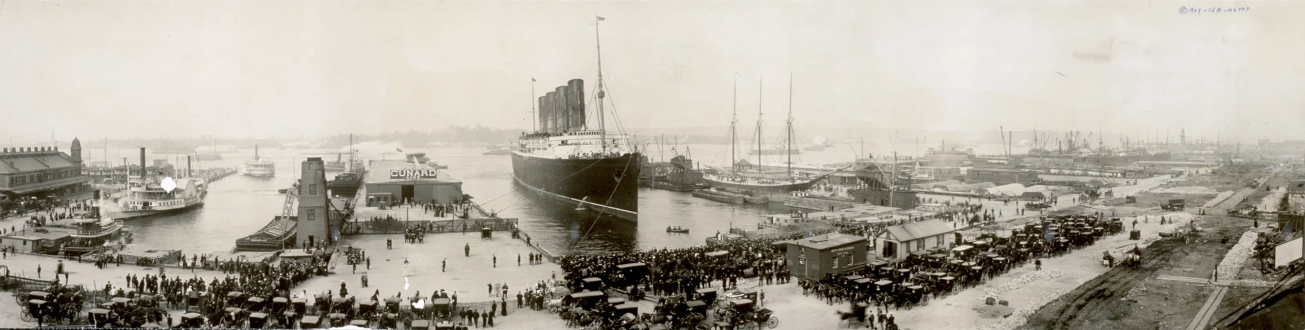 RMS Lusitania at the end of her record westbound Atlantic crossing voyage, 1907. A Dillman family group member arrived in New York aboard the Lusitania in 1908. The ship was torpedoed and sunk by German submarine U-20 on May 7, 1915, killing 1,198 of the 1,959 people aboard. Library of Congress. Public domain.